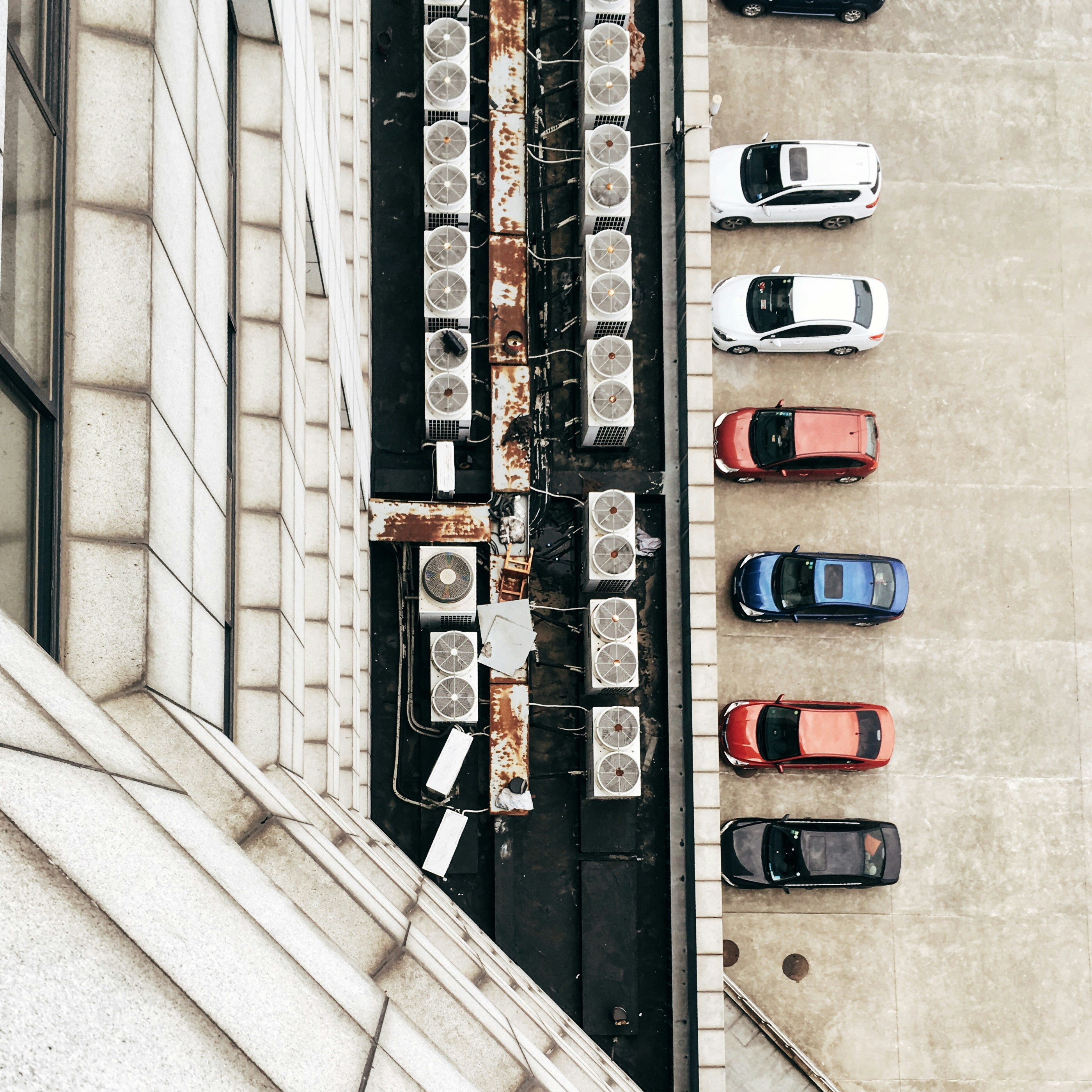 aerial photo of air condenser units and cars